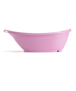 Bañera ovalada de color rosado vista desde el costado