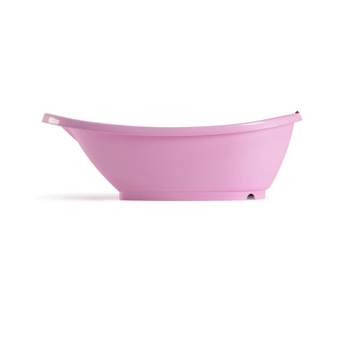 Bañera ovalada de color rosado vista desde el costado